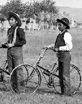Vintage photo of two boys with bicycles